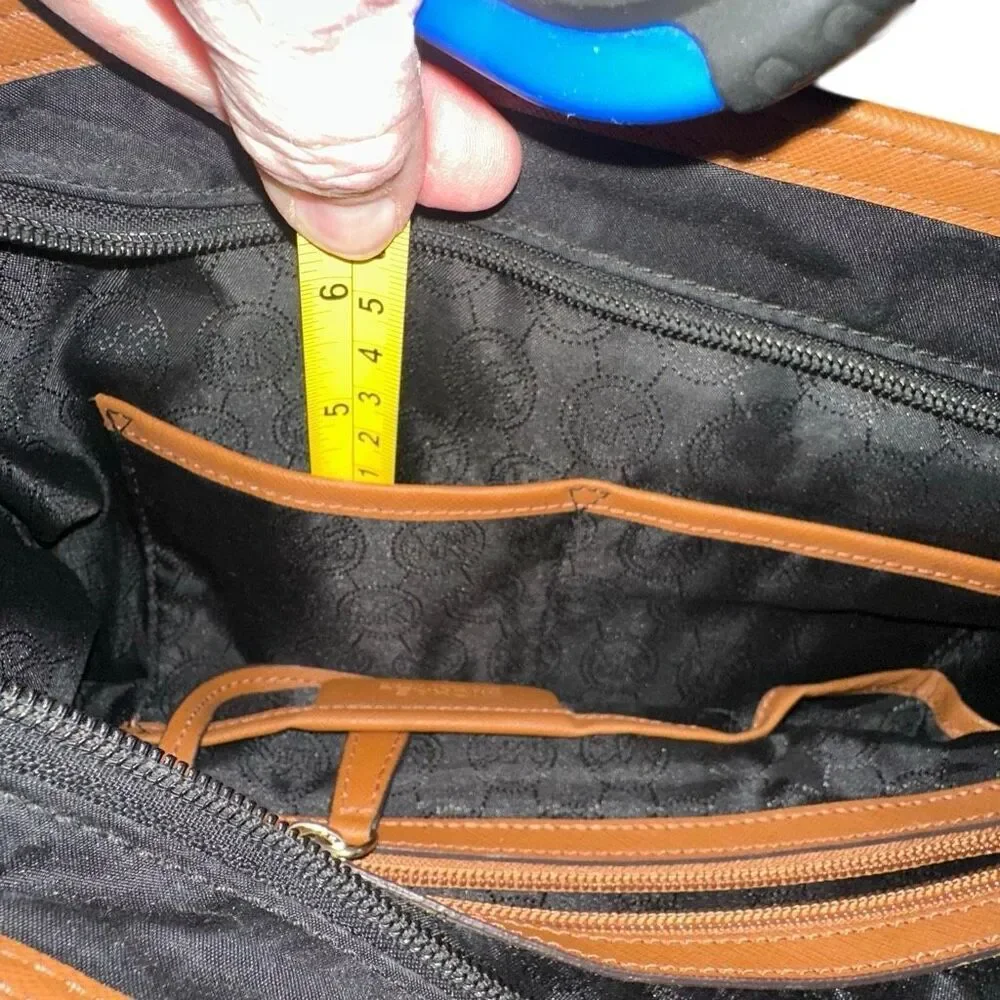 Michael kors black purse w/ tan trim 6 pockets